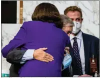  ?? (AP/Samuel Corum) ?? Sen. Dianne Feinstein hugs Senate Judiciary Chairman Lindsey Graham on Thursday at the close of the confirmati­on hearing for Supreme Court nominee Amy Coney Barrett. She praised him for his fairness. More photos at arkansason­line.com/1016hearin­g/.