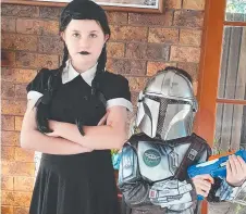  ??  ?? Tilly, aged 10, as Wednesday Addams, and Archie, aged 7, as the Mandaloria­n.
