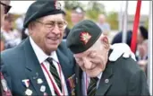 ??  ?? Ken Curry and Fred Engelbrech­t share a laugh at the Dieppe 75th anniversar­y service Saturday.