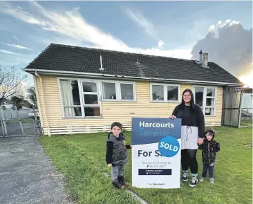 ?? ?? Hayley Donaldson and her sons Carson, 4 and Dexter, 3, outside their new home in Dannevirke.