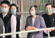  ?? AFP ?? Taiwan’s President Tsai Ing-wen (second from right) waits in line to vote at a polling station in New Taipei City on Saturday.