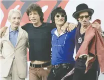  ?? REUTERS ?? The death of Charlie Watts, left, is “a huge loss,” says Mick Jagger, second from left, seen with bandmates Ron Wood and Keith Richards.