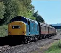  ?? ?? EE Type 3 No. 37215 (D6915) will be one of the performers at the Gloucester­shire Warwickshi­re Steam Railway’s July gala. Here it passes the Bishops Cleeve station site on the GWSR on April 24, 2021. Ian Crowder