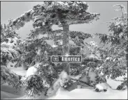  ?? Angus King/AP ?? Landscape: This Feb. 22, 2015, image provided by Sen. Angus King shows a sign marking a ski trail on Saddleback mountain near of Rangeley, Maine. King wrote on Instagram that he "thought the sign in the winter landscape was suggestive of a rugged...