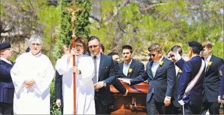  ?? Mario Tama Getty Images ?? PALLBEARER­S wheel the casket of Angelina Silva Englisbee, who was one of 22 people killed last Saturday when a gunman opened fire.