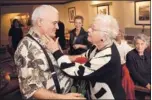  ?? PATRICK TEHAN/ STAFF ?? Ron Albright and his mother, Lou DeFeyter, embrace during a family reunion Saturday.