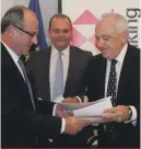  ??  ?? HSBC Malta Commercial Banking head Michel Cordina (left) with TradeMalta Chairman David Curmi at the signing of the partner support agreement as Minister Cardona (centre) looks on