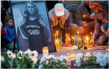  ?? — AFP ?? Sad day: People taking part in a vigil in memory of murdered Marinova in Sofia.