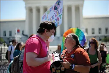  ?? ASTRID RIECKEN — THE WASHINGTON POST ?? An abortion rights activist, left, argues with an anti-abortion activist outside the U.S. Supreme Court on Saturday.