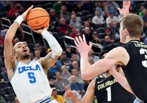  ?? David Becker The Associated Press ?? UCLA freshman guard Amari Bailey scored a career-high 26 points in a quarterfin­al win over Colorado.