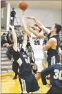  ?? Bud Sullins/Special to Siloam Sunday ?? Siloam Springs sophomore Murphy Perkins drives to the basket as Collin Blackburn of Bentonvill­e West attempts to take a charge during both teams’ seasonopen­ers Tuesday at Panther Arena.