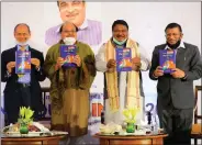  ??  ?? Jual Oram, M.P. & Chairperso­n Standing Committee on Defence, Government of India, with R.P. Gupta, launching the book.