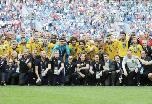  ?? AP ?? Belgium’s players and officials pose after beating England 2-0 in the third place match in the St. Petersburg Stadium on Saturday. —