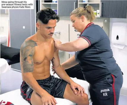  ??  ?? Mesa going through his pre-season fitness tests with Swansea physio Kate Rees