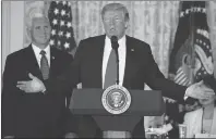  ?? AP PHOTO ?? Vice President Mike Pence listens as President Donald Trump speaks during a meeting of the National Space Council in the East Room of the White House, Monday.