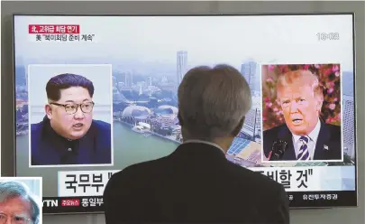  ?? AP PHOTOS ?? TOUGH TALK: A man watches a TV screen showing file footage of President Trump, right, and North Korean leader Kim Jong Un. Un’s government blasted John Bolton, left, this week.