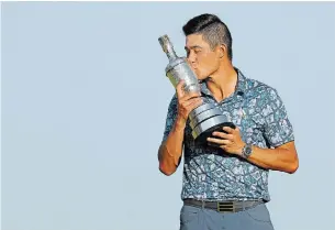  ?? ANDREW REDINGTON GETTY IMAGES ?? Collin Morikawa kisses the Claret Jug after winning the Open Championsh­ip on Sunday.