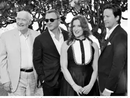  ??  ?? Daniel Craig (second left) with the production team of (from left) Michael G. Wilson, Barbara Broccoli, and Cary Joji Fukunaga.