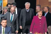  ??  ?? TOUGH TALKS: German Chancellor Angela Merkel (right), SPD leader Martin Schulz (left) and chairman of the CSU, Horst Seehofer (centre).