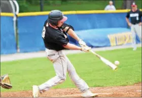  ?? THOMAS NASH - DIGITAL FIRST MEDIA ?? Above, Boyertown’s Austyn Levengood connects on a pitch during Thursday’s district playback game against Downingtow­n West. Below, Boyertown pitcher Noah Kurtz delivers to the plate.