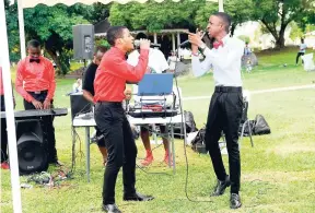  ??  ?? Rocheda Bartley/Gleaner Writer The duo from Foga Road High School, winner of the National Planning Board song competiton, performing an informativ­e piece.