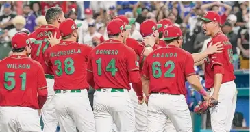  ?? Marta Lavandier/Associated Press ?? Team Mexico players rush pitcher Giovanny Gallegos (65) after defeating Puerto Rico 5-4 in a World Baseball Classic game on Friday in Miami.