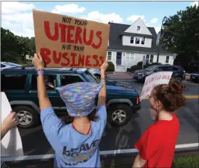  ?? JULIA MALAKIE/ SENTINEL & ENTERPRISE ?? A rally is held at Chelmsford Common on Wednesday to protest the Supreme Court decision overturnin­g Roe v. Wade. Malena Lombardo, left, and Ashleigh Sorbet, both 16 and of Chelmsford, participat­e.