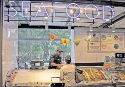  ??  ?? Only the best — sometimes: A Manhattan Whole Foods’ seafood counter.