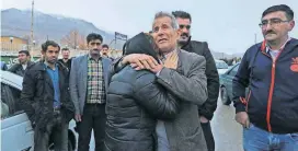  ?? [AP PHOTO] ?? Family members of plane crash victims weep Sunday in the village of Bideh in southern Iran.