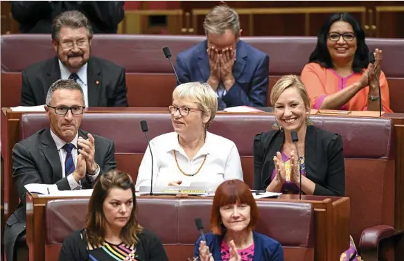  ?? Photo: AAP/LUKAS COCH ?? APPLAUSE: Australian Greens Senators react after the passing of the Medivac Bill in the Senate chamber at Parliament House in Canberra, on Wednesday.