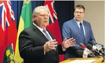  ?? MATT OLSON ?? Ontario Premier Doug Ford, left, and Saskatchew­an Premier Scott Moe stand together in fighting a national price on pollution.