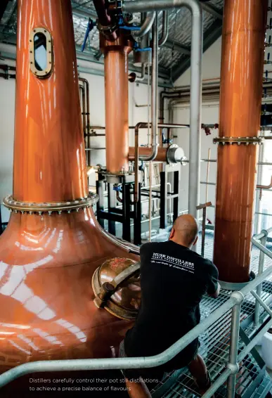  ??  ?? Distillers carefully control their pot still distillati­ons to achieve a precise balance of flavours