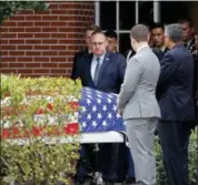  ?? GERALD HERBERT — THE ASSOCIATED PRESS ?? The casket of Alaina Petty, a victim of Wednesday’s mass shooting at Marjory Stoneman Douglas High School, leaves her funeral in Coral Springs, Fla., Monday.