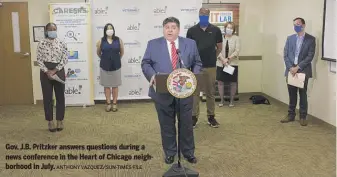  ?? ANTHONY VAZQUEZ/SUN-TIMES FILE ?? Gov. J.B. Pritzker answers questions during a news conference in the Heart of Chicago neighborho­od in July.