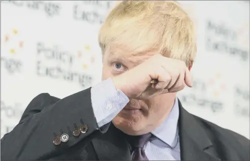  ?? PICTURES: PA WIRE ?? Foreign Secretary Boris Johnson wipes sweat from his brow as he delivers his speech at the Policy Exchange in London.