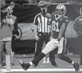  ?? Associated Press ?? In for six: In this Aug. 30, 2018, file photo, New Orleans Saints wide receiver Cameron Meredith (81) celebrates his touchdown reception in the first half of an NFL preseason football game against the Los Angeles Rams in New Orleans.