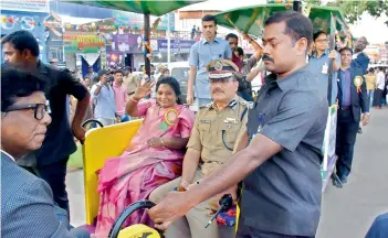  ?? — INN ?? Telangana Governor Dr Tamilisai Soundarara­jan enjoys a ride on the toy train along with Hyderabad police commission­er Anjani Kumar at Numaish on Thursday.