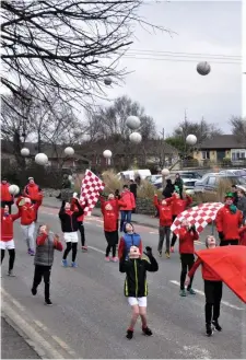  ??  ?? Coolera/Strandhill GAA players showing their skills during the St Patrick’s Day parade.