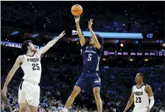  ?? AP photos RIGHT PHOTO: ?? LEFT PHOTO: Saint Peter’s Daryl Banks III goes up for a shot against Purdue’s Ethan Morton as Jaden Ivey looks on during the second half Friday. Saint Peter’s Doug Edert celebrates in the second half.