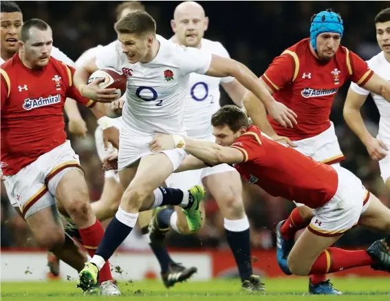  ?? PICTURE: Getty Images ?? Still improving: Owen Farrell goes past Dan Biggar in England’s Six Nations match with Wales