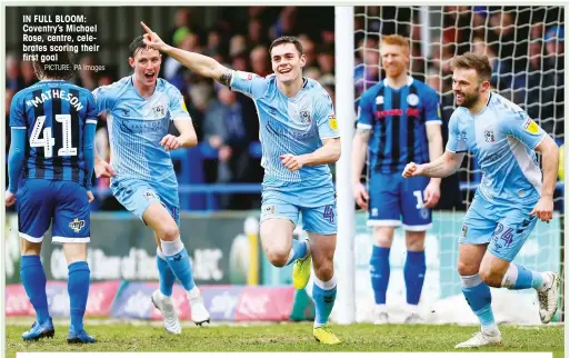  ?? PICTURE: PA Images ?? IN FULL BLOOM: Coventry’s Michael Rose, centre, celebrates scoring their first goal