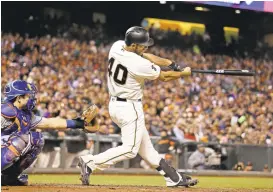  ?? ERIC RISBERG/ASSOCIATED PRESS ?? Giants’ pitcher Madison Bumgarner hits a two-run home run off New York Mets starting pitcher Jacob deGrom during the fourth inning Thursday evening in San Francisco. Catcher Travis d’Arnaud of the Mets watches the swing. The Giants struggled to win the...