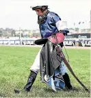  ??  ?? Ryan Moore, jockey of The Cliffsofmo­her, walks dejectedly off the track.