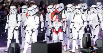  ??  ?? People dressed as Storm Trooper characters from ‘Star Wars’ attend the launch of Christmas lights at Galeries Lafayette department store in Paris ahead of the holiday season in the French capital, recently.