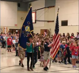  ??  ?? Bradford Heights Elementary School students participat­ed in the Patriots Day ceremony at their West Bradford Township school on Tuesday to honor those who died in the terrorist attacks 17 years ago.