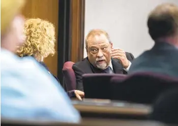  ?? GETTY IMAGES ?? Greg McMichael listens to his attorney, Laura Hogue, deliver closing arguments Monday. McMichael, his son Travis McMichael and William “Roddie” Bryan are charged with the fatal shooting of Ahmaud Arbery.