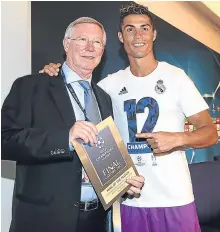  ??  ?? Ronaldo with Sir Alex Ferguson after winning Man of the Match at the Champions League Final.