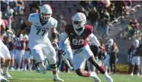  ?? PHOTOS COURTESY OF LAFAYETTE COLLEGE ?? Lafayette senior defensive end Malik Hamm tries to get pressure on the Georgetown quarterbac­k during the Leopards’ 30-20 loss Saturday at Fisher Stadium. Georgetown right tackle Mac Hollenstei­ner tries to prevent Hamm from making the tackle. Hamm had a sack and a forced fumble among his five tackles.