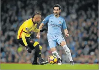  ?? Picture: REUTERS ?? BIG CONCERN: Manchester City’s Ilkay Gundogan, right, seen here in action with Watford’s Roberto Pereyra, had to be substitute­d in City’s 2-0 Premier League win over Watford after he picked up an injury