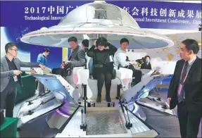  ?? PHOTOS PROVIDED TO CHINA DAILY ?? Visitors experience virtual reality games at the Technologi­cal Innovation Exhibition during the Guangzhou Annual Investment Conference on March 28.